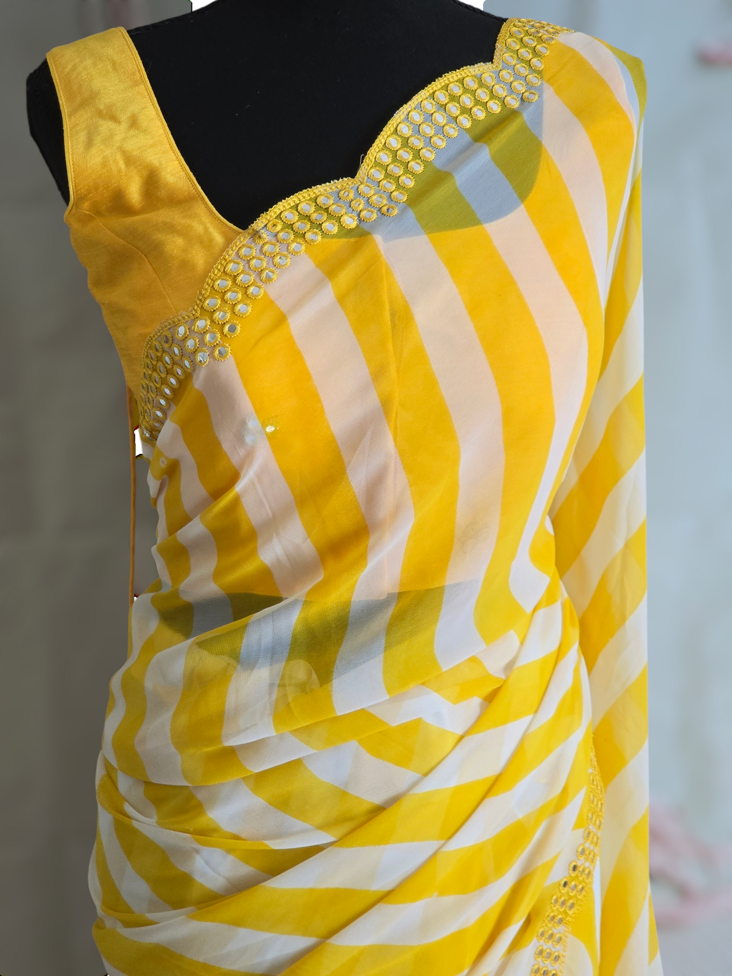 Yellow/white chiffon saree with border mirror work- stitched sleeveless blouse