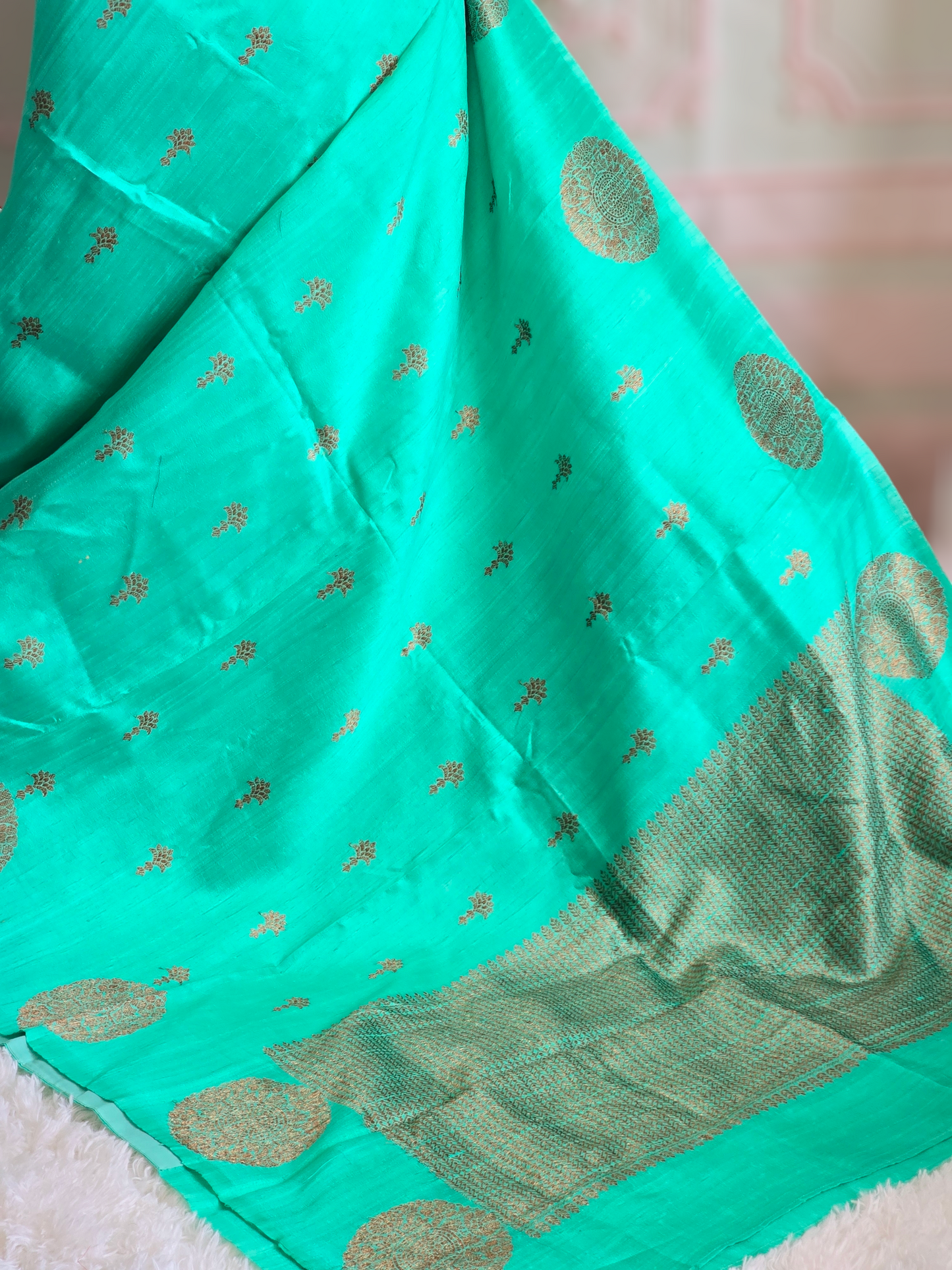 Pure raw silk saree(sea green/blue) with antique gold design- stitched blouse