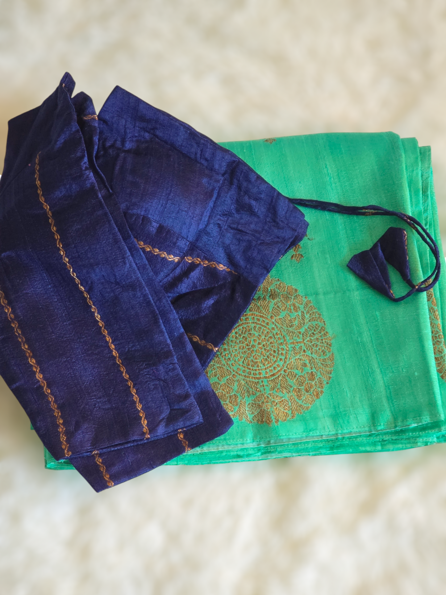 Pure raw silk saree(sea green/blue) with antique gold design- stitched blouse