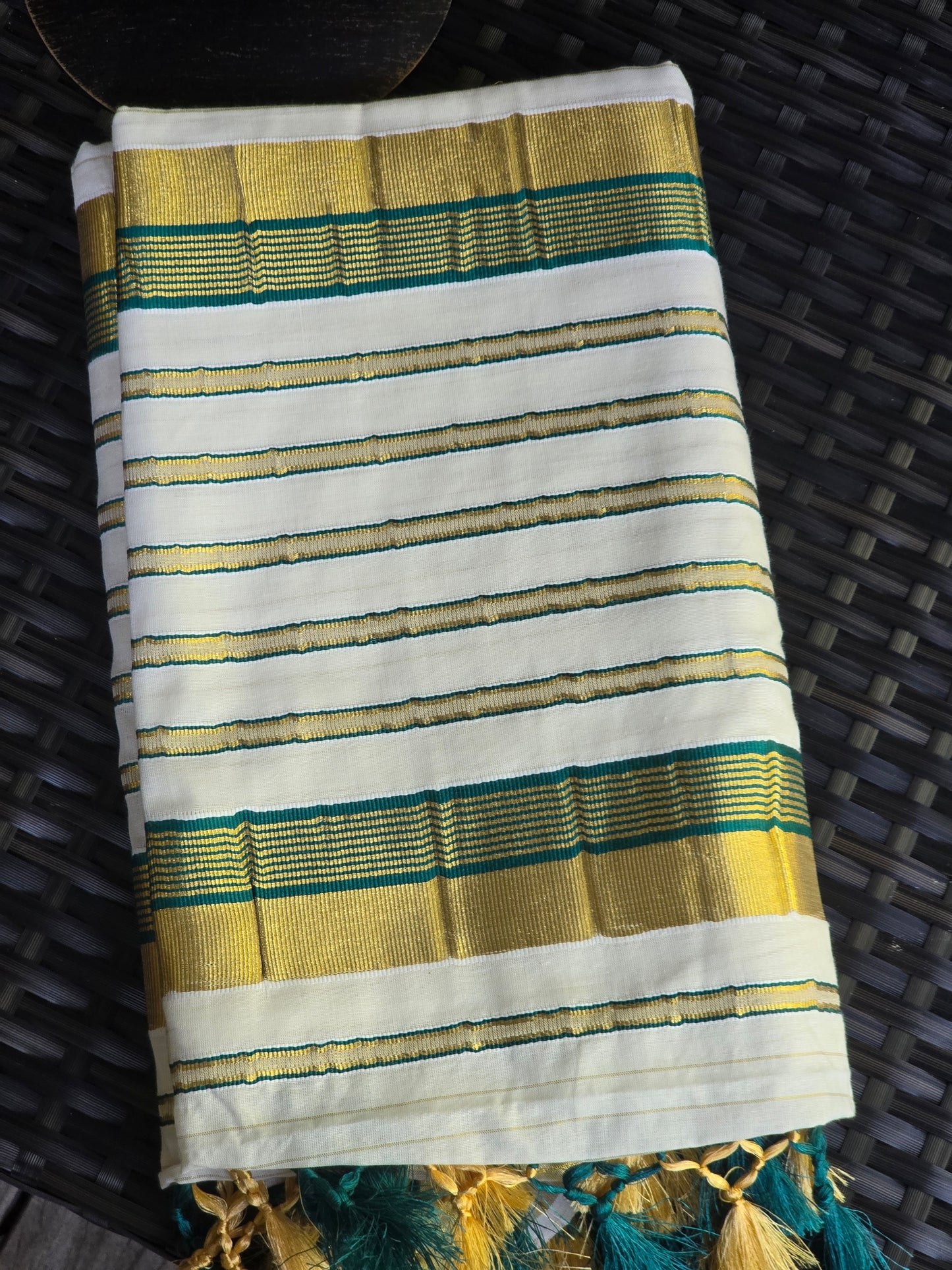 Onam set saree with green border on Pallu ( body gold line)
