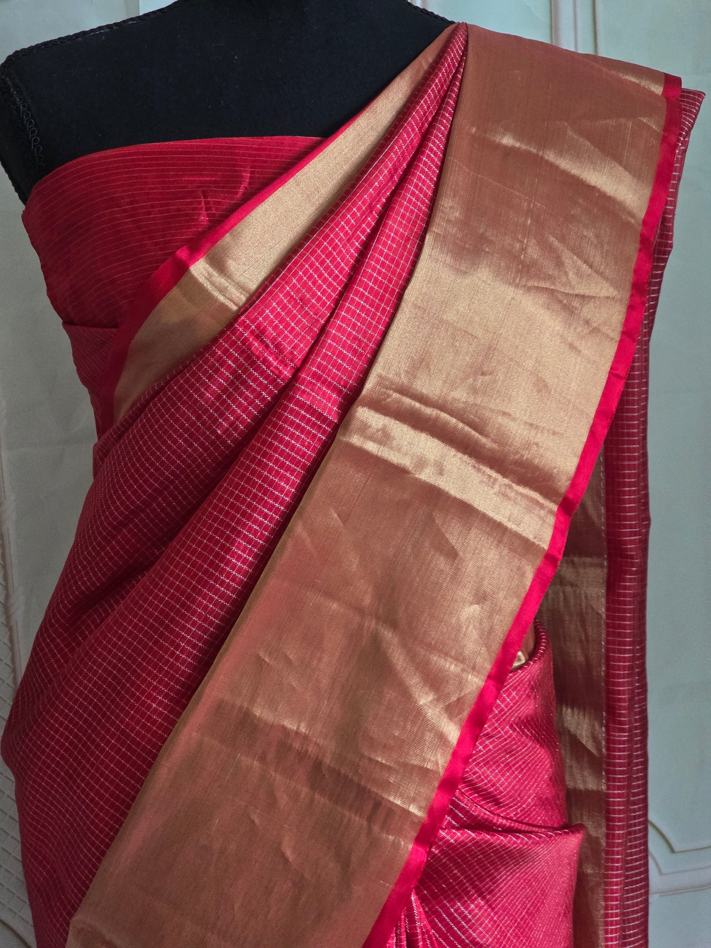 Kancheepuram soft silk check design saree with copper zari-stitched blouse