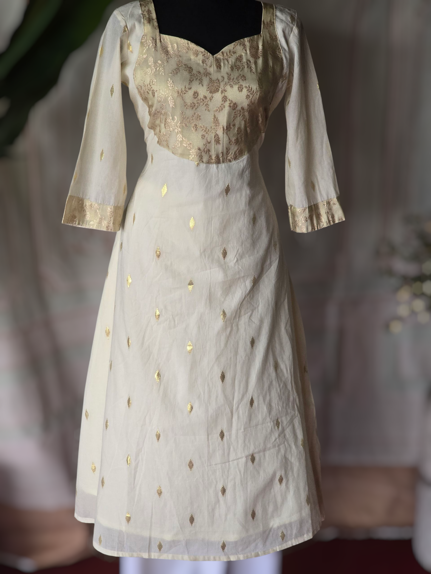 Off white A line kurti with yoke design