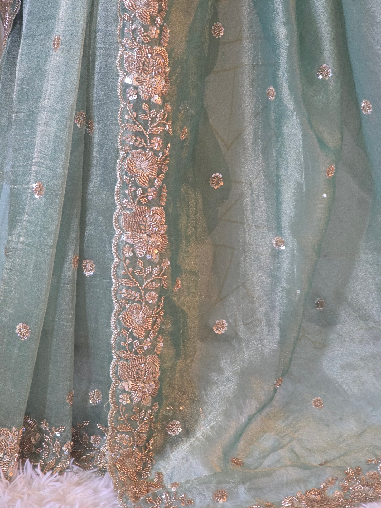 Sage green designer crushed tissue saree with heavy work- stitched designer sleevless blouse