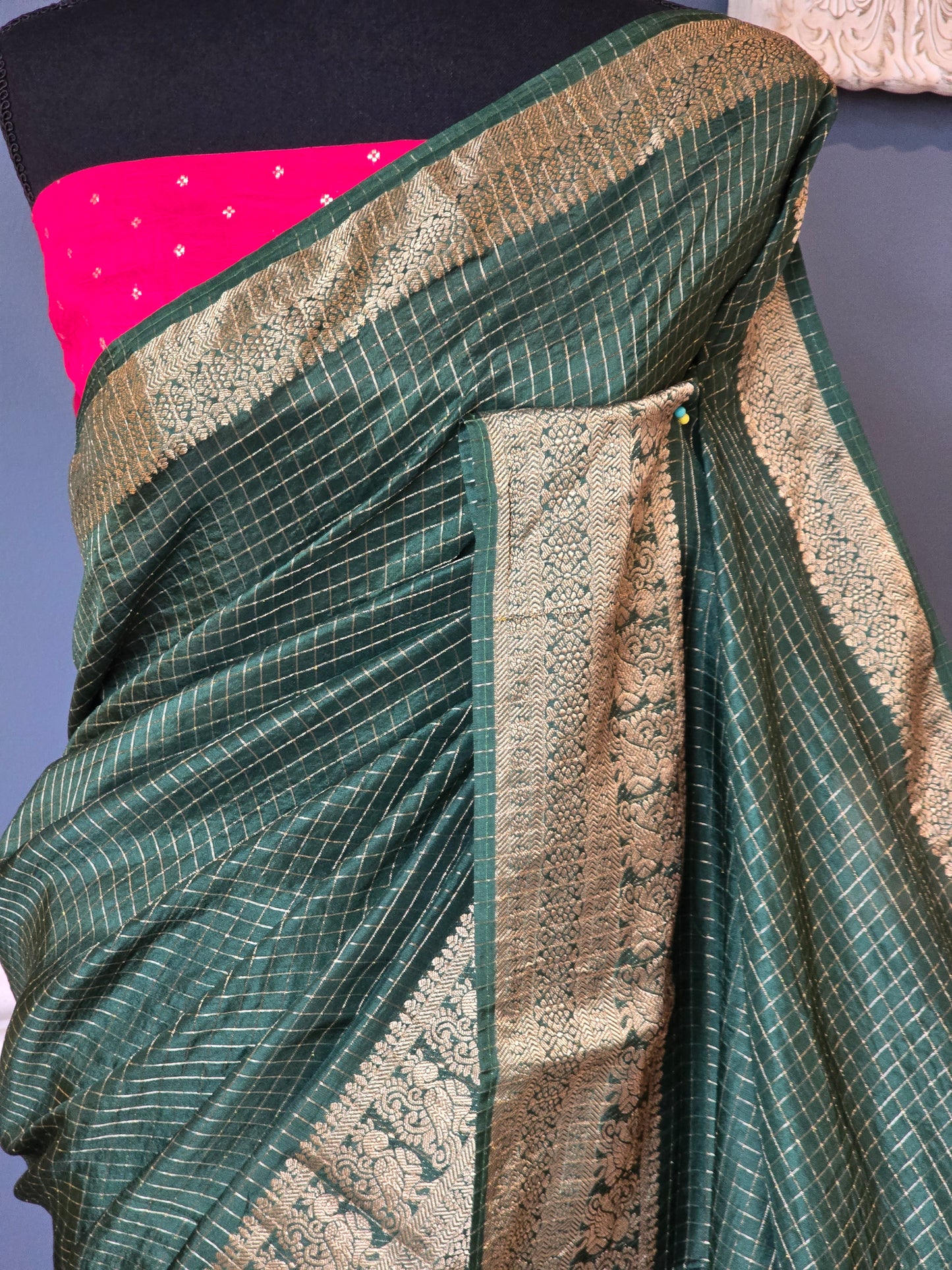 Crape silk saree with check design body= stitched contrast blouse