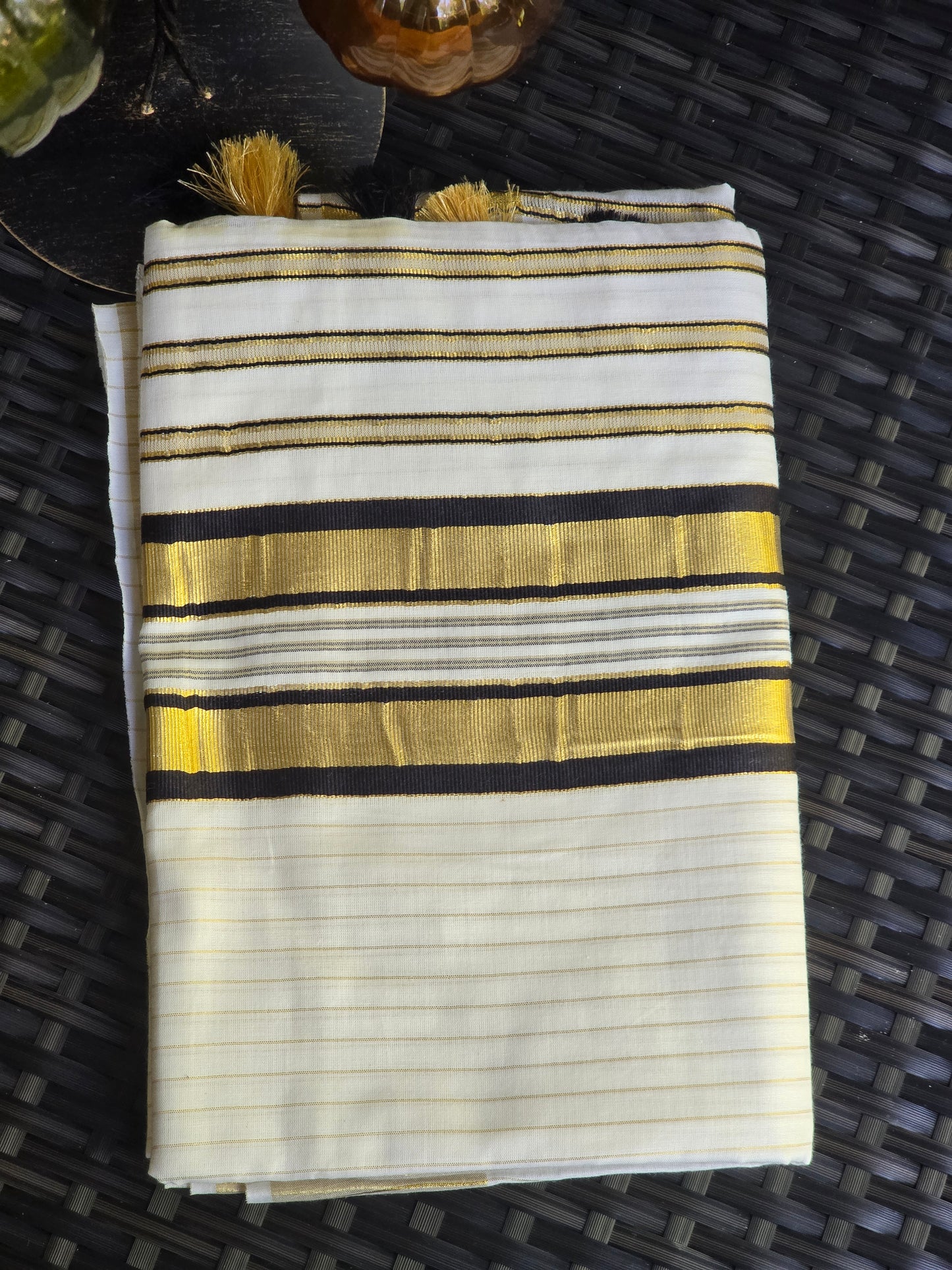Onam set saree with black border on Pallu ( body gold line)