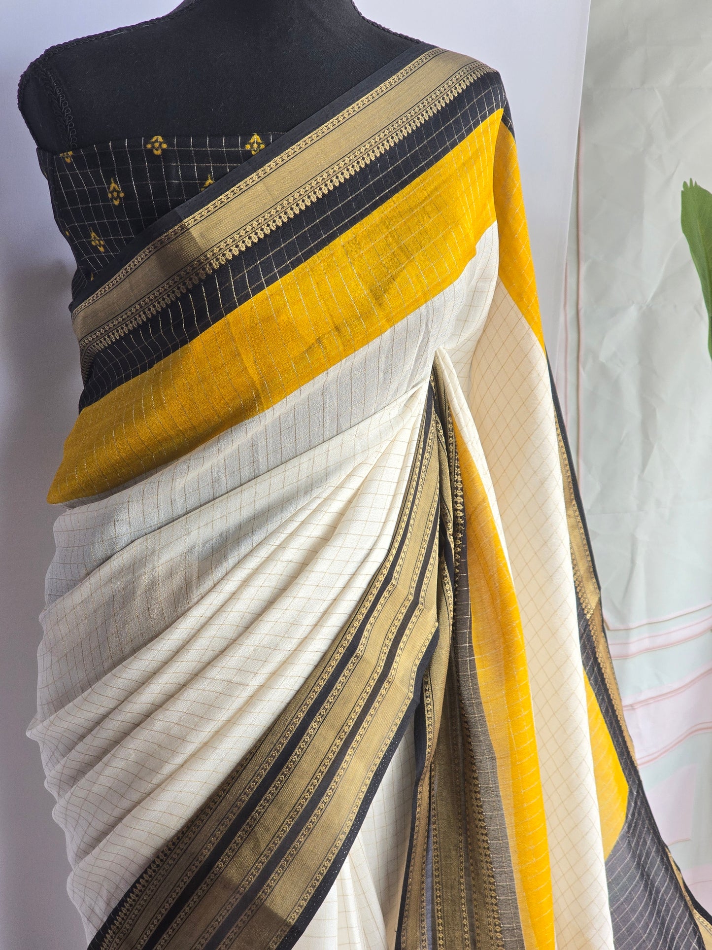 Semi georgette saree with yellow black border-stitched blouse