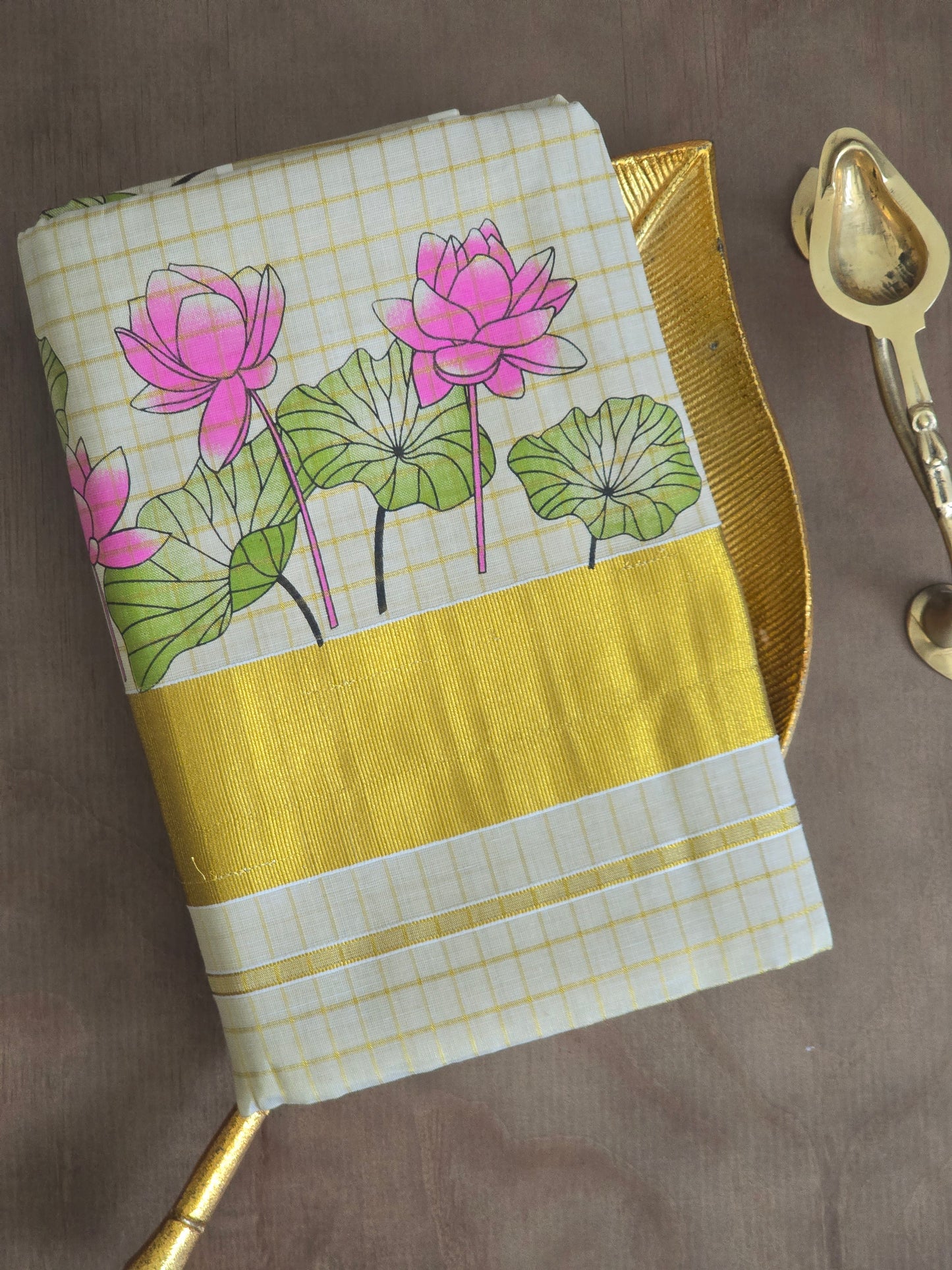 Gold tissue check set saree with lotus print