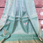 Aqua blue tissue silk saree with light pink Stitched blouse