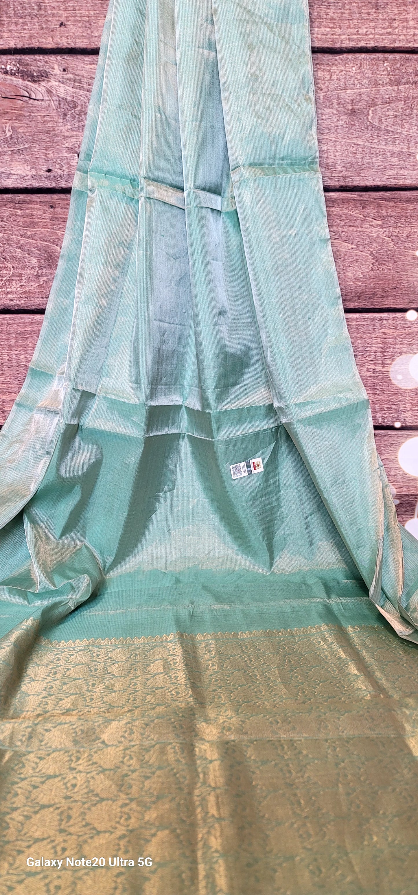 Aqua blue tissue silk saree with light pink Stitched blouse