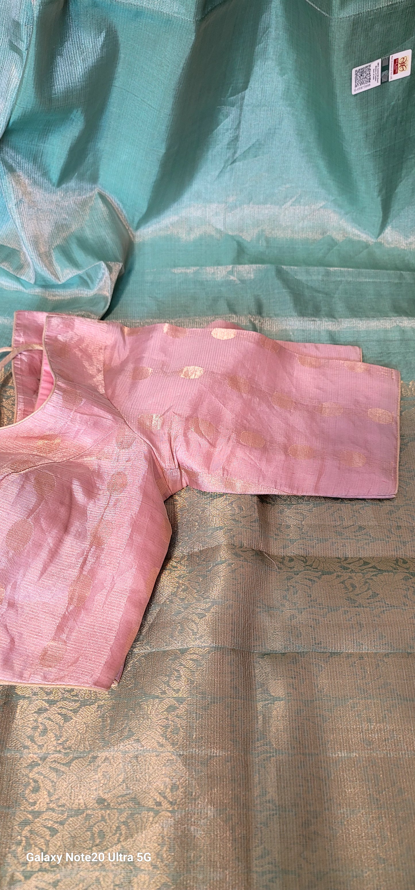 Aqua blue tissue silk saree with light pink Stitched blouse