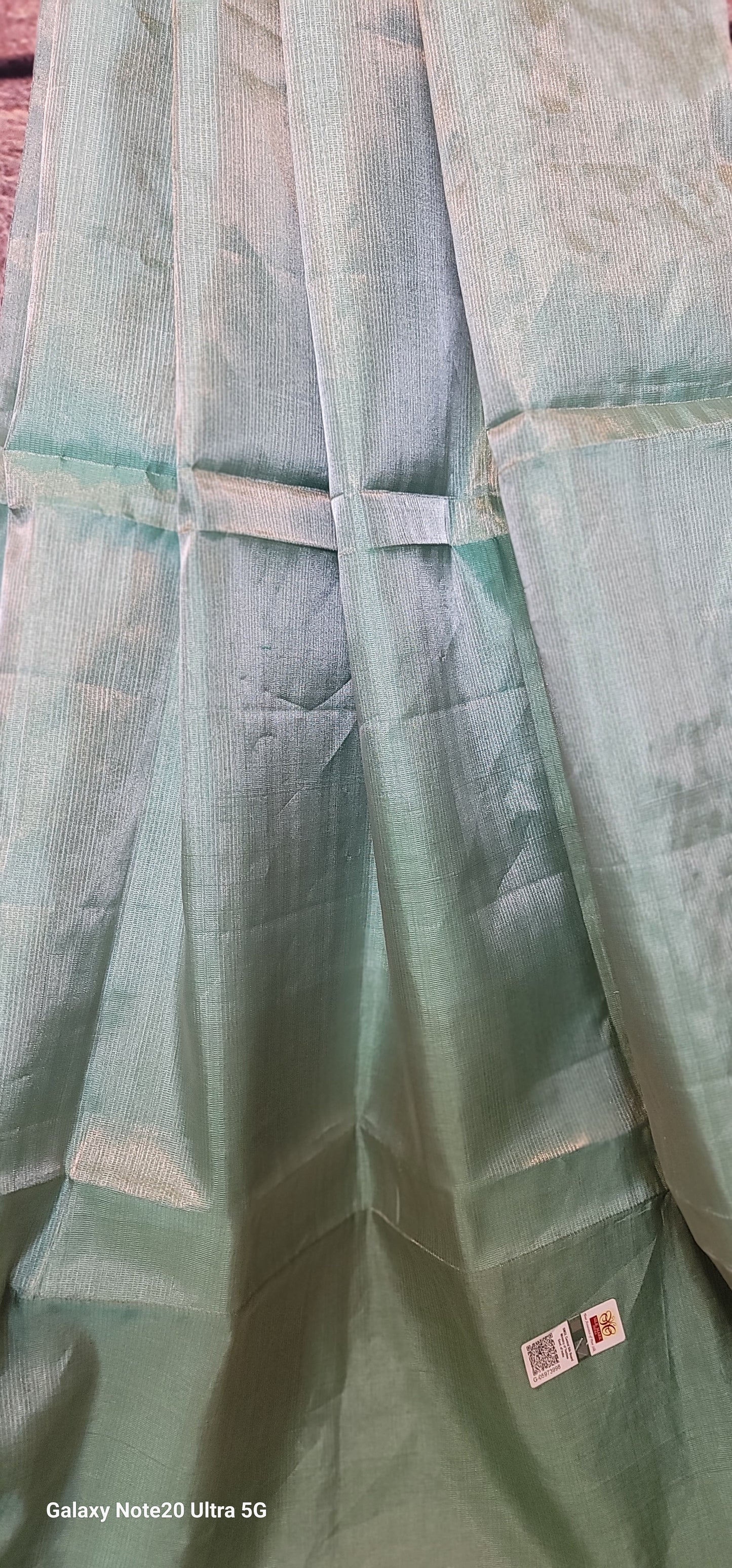 Aqua blue tissue silk saree with light pink Stitched blouse