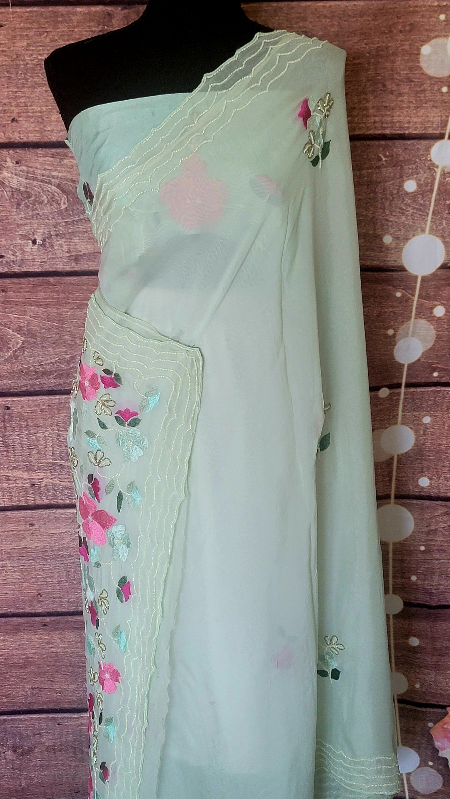 Mint green party wear saree with pearl and thread work- stitched blouse