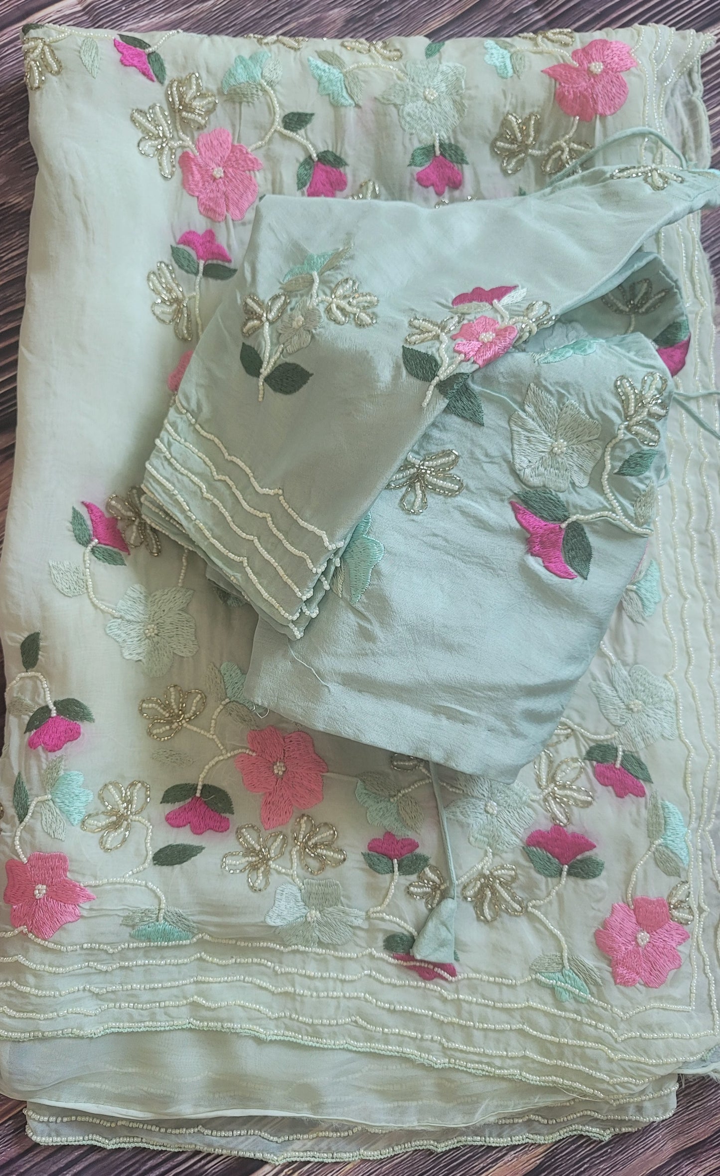 Mint green party wear saree with pearl and thread work- stitched blouse