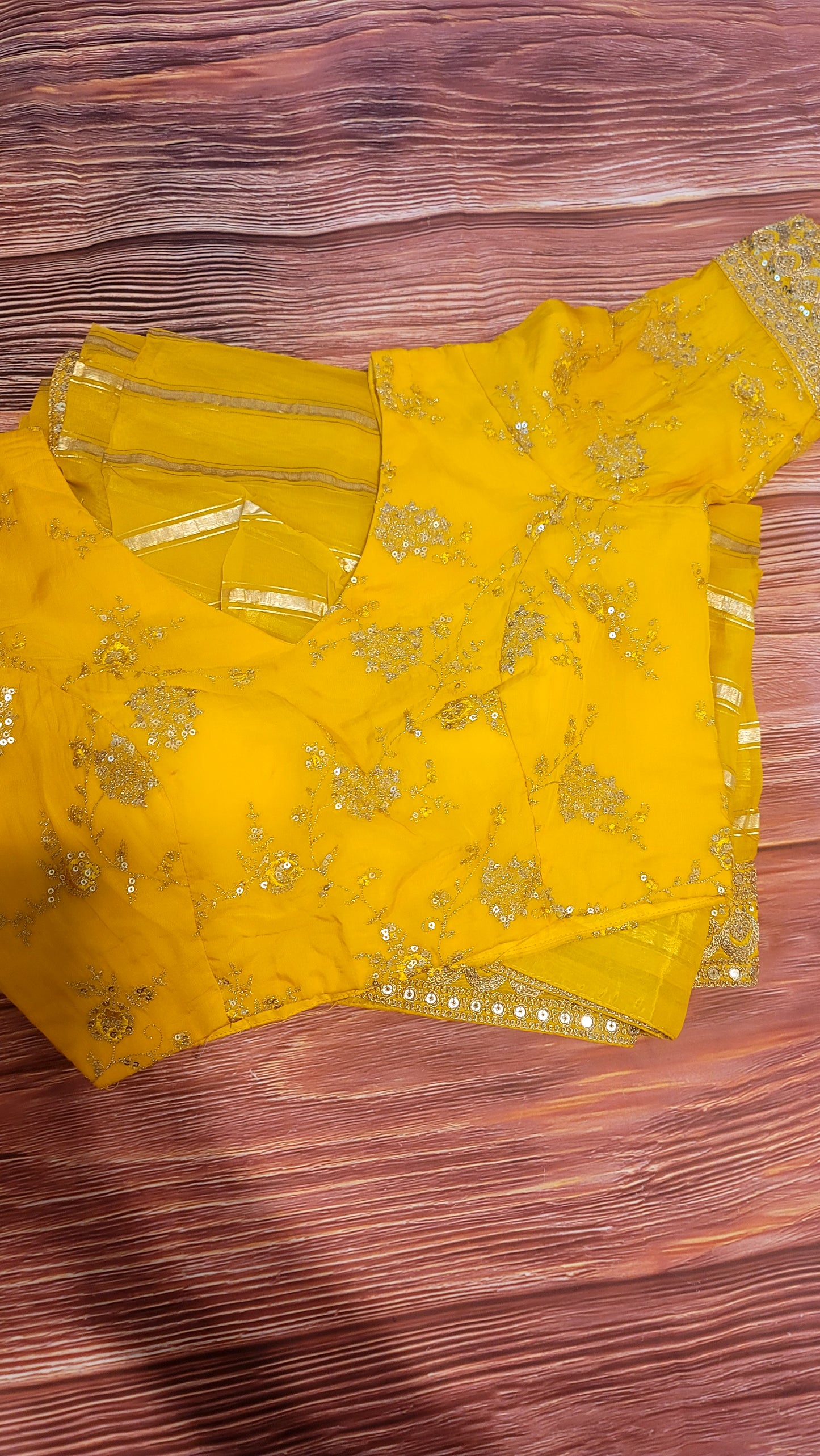 Yellow organza designer saree with stitched blouse