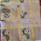 Tissue set saree with dark green/ gold weaving