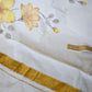 Set saree with yellow floral design (blouse available extra)