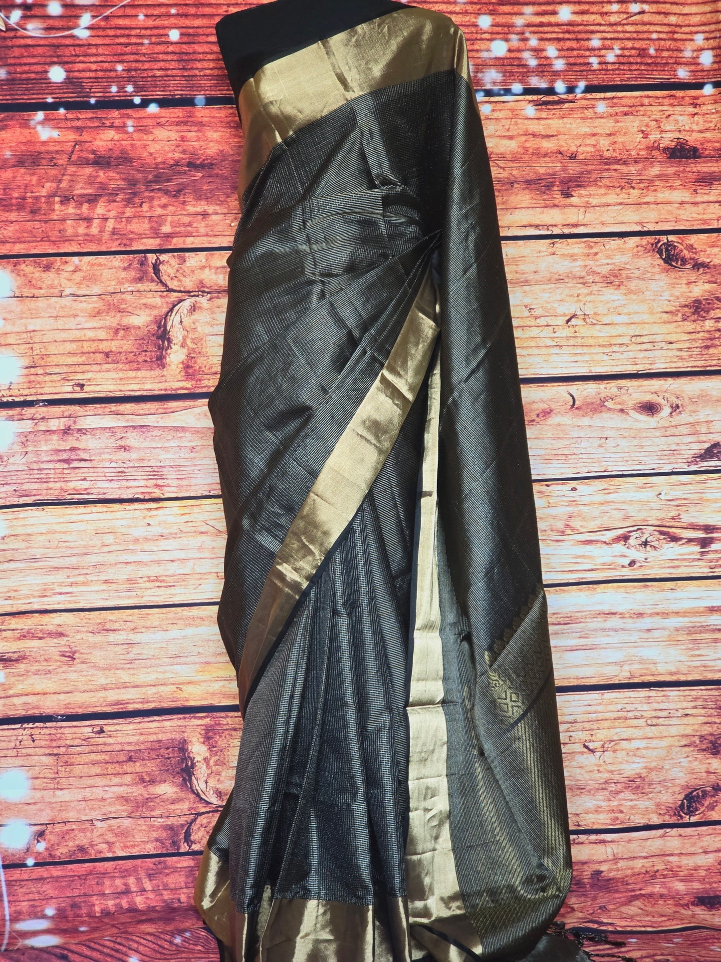 Black check silk saree with copper border- stitched blouse