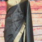 Black check silk saree with copper border- stitched blouse