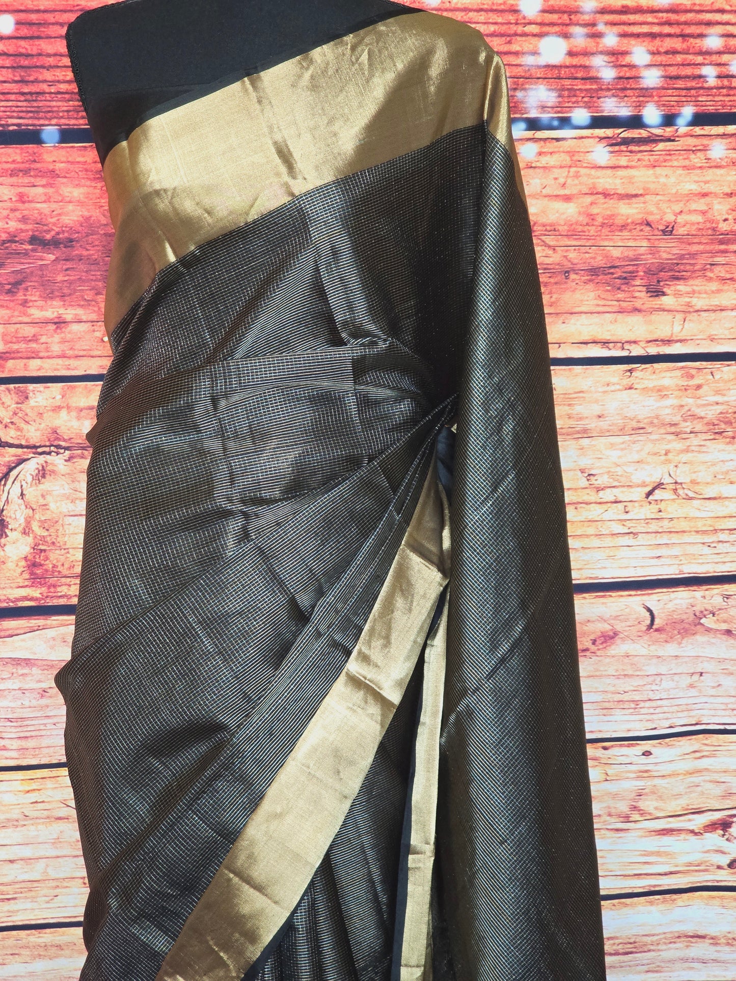 Black check silk saree with copper border- stitched blouse