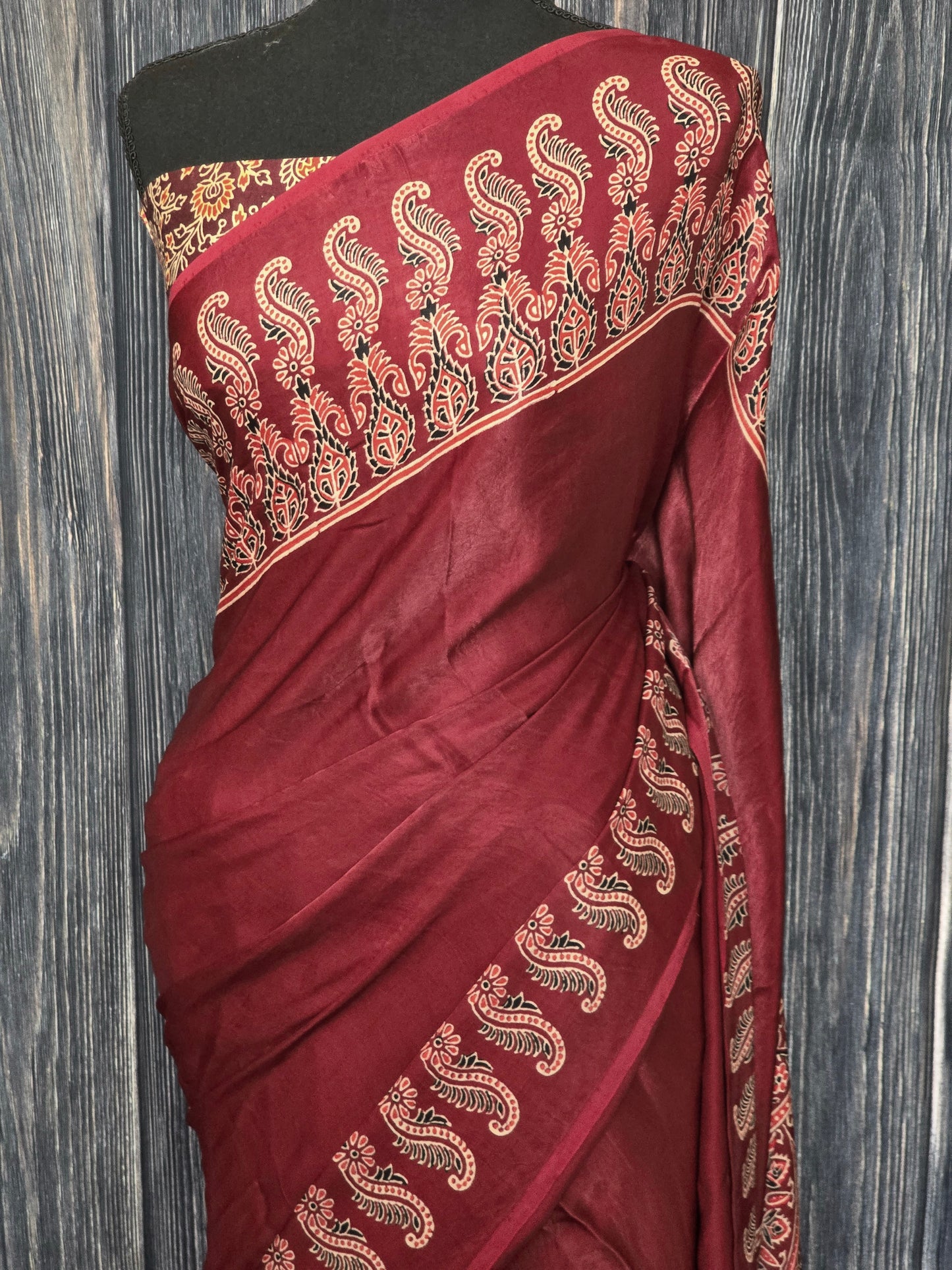 Redish maroon modal silk saree with stitched blouse