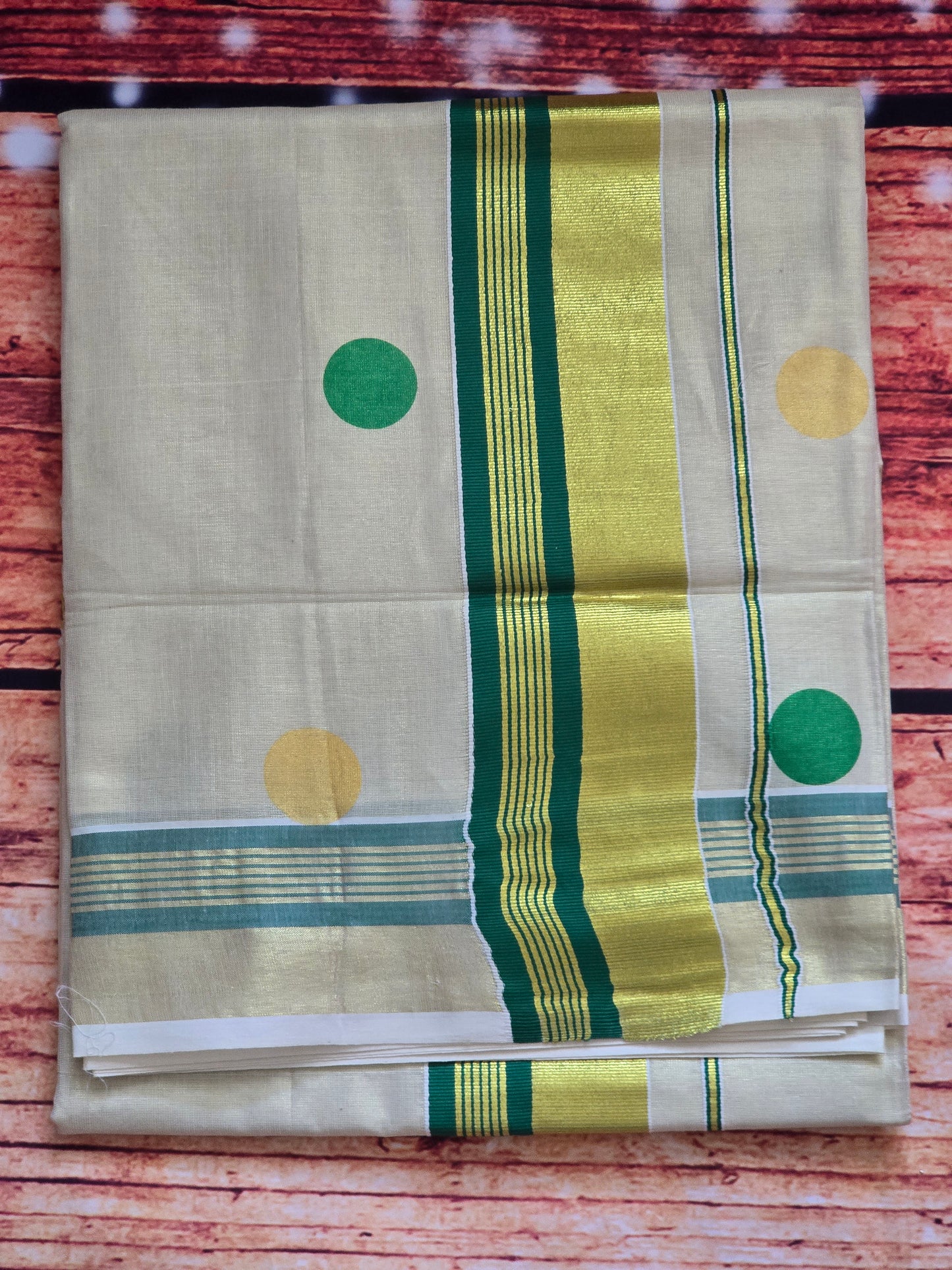 Tissue set saree with green / gold polka dots