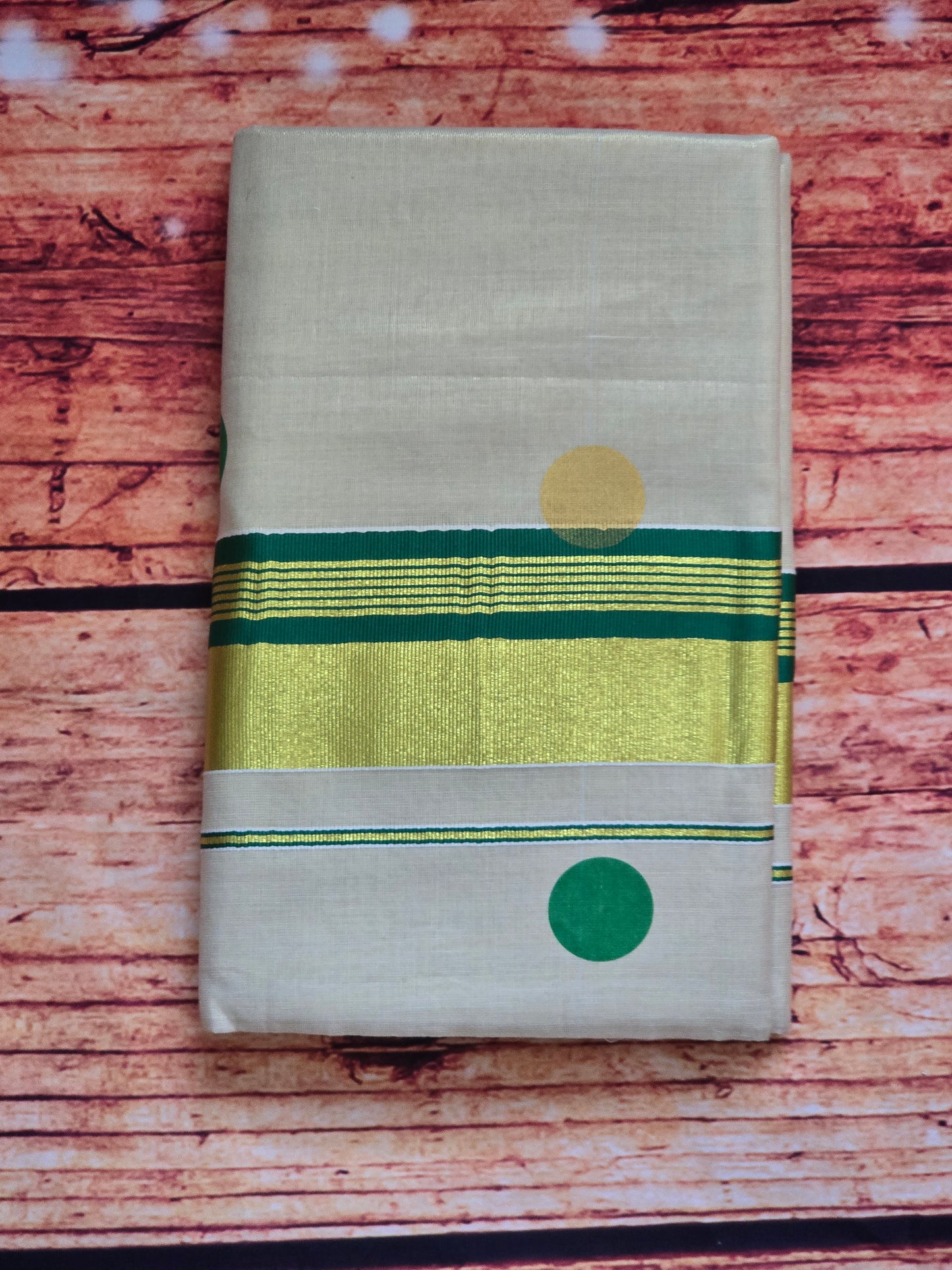 Tissue set saree with green / gold polka dots