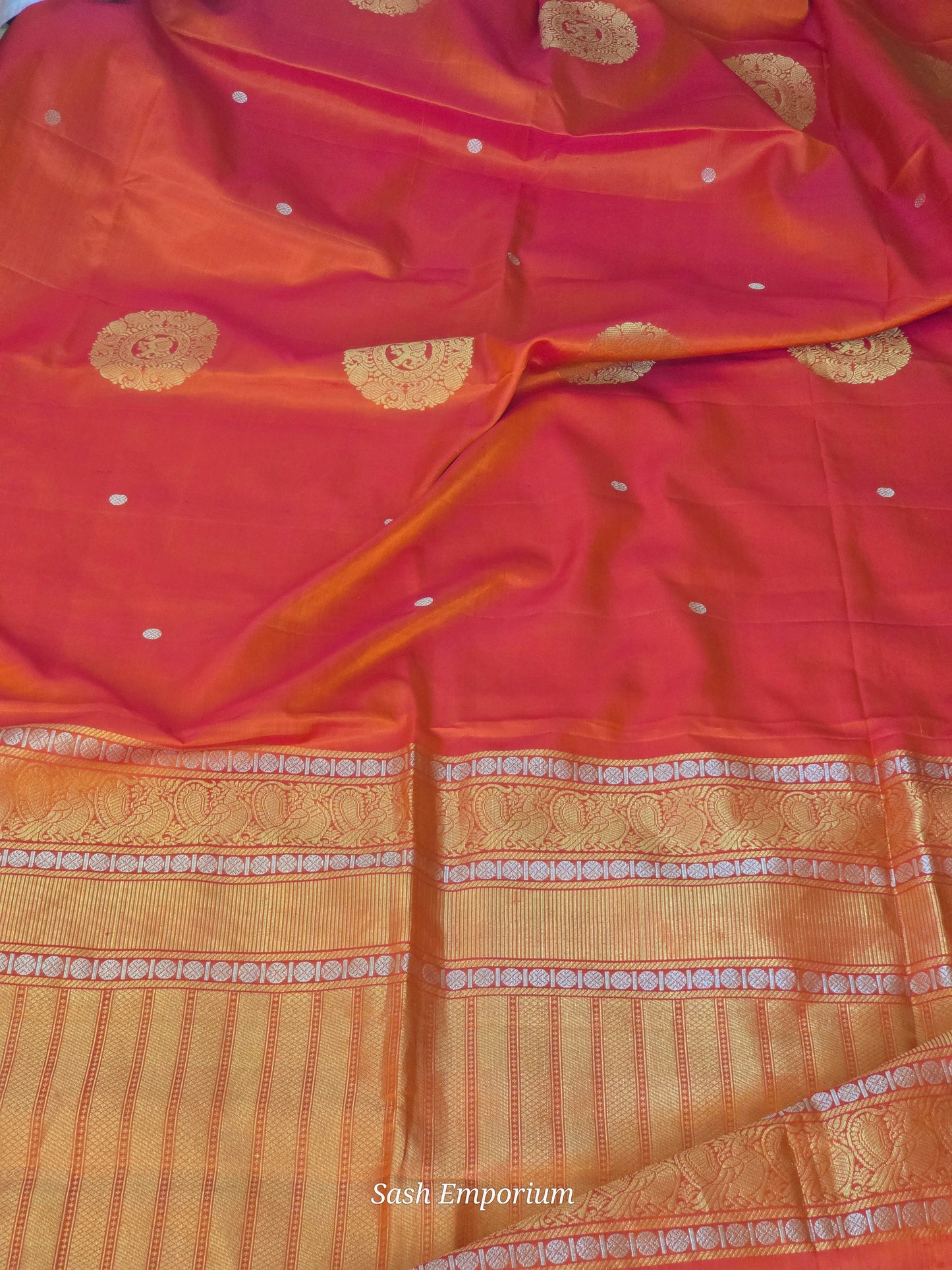 Soft silk ( peach/orange tone) kancheepuram saree with stitched blouse