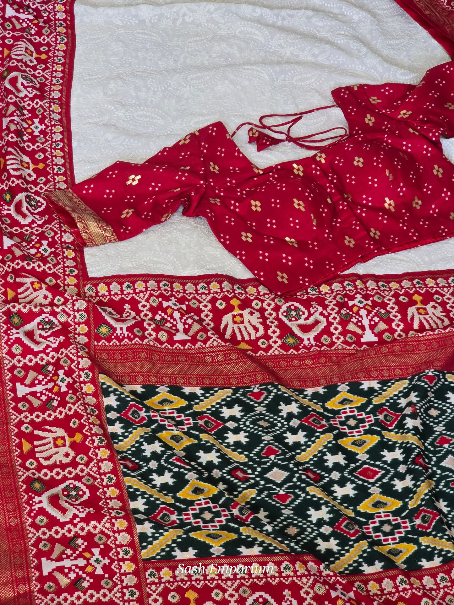 White/Red chiffon saree with white chikankari work on body and  patola border