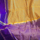 Yellow/purple check design raw silk saree with stitched blouse