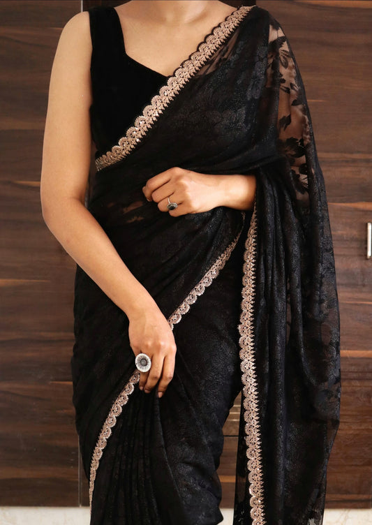 Black net saree with border- stitched blouse