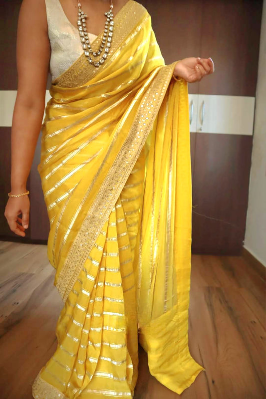 Yellow organza designer saree with stitched blouse