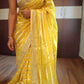 Yellow organza designer saree with stitched blouse