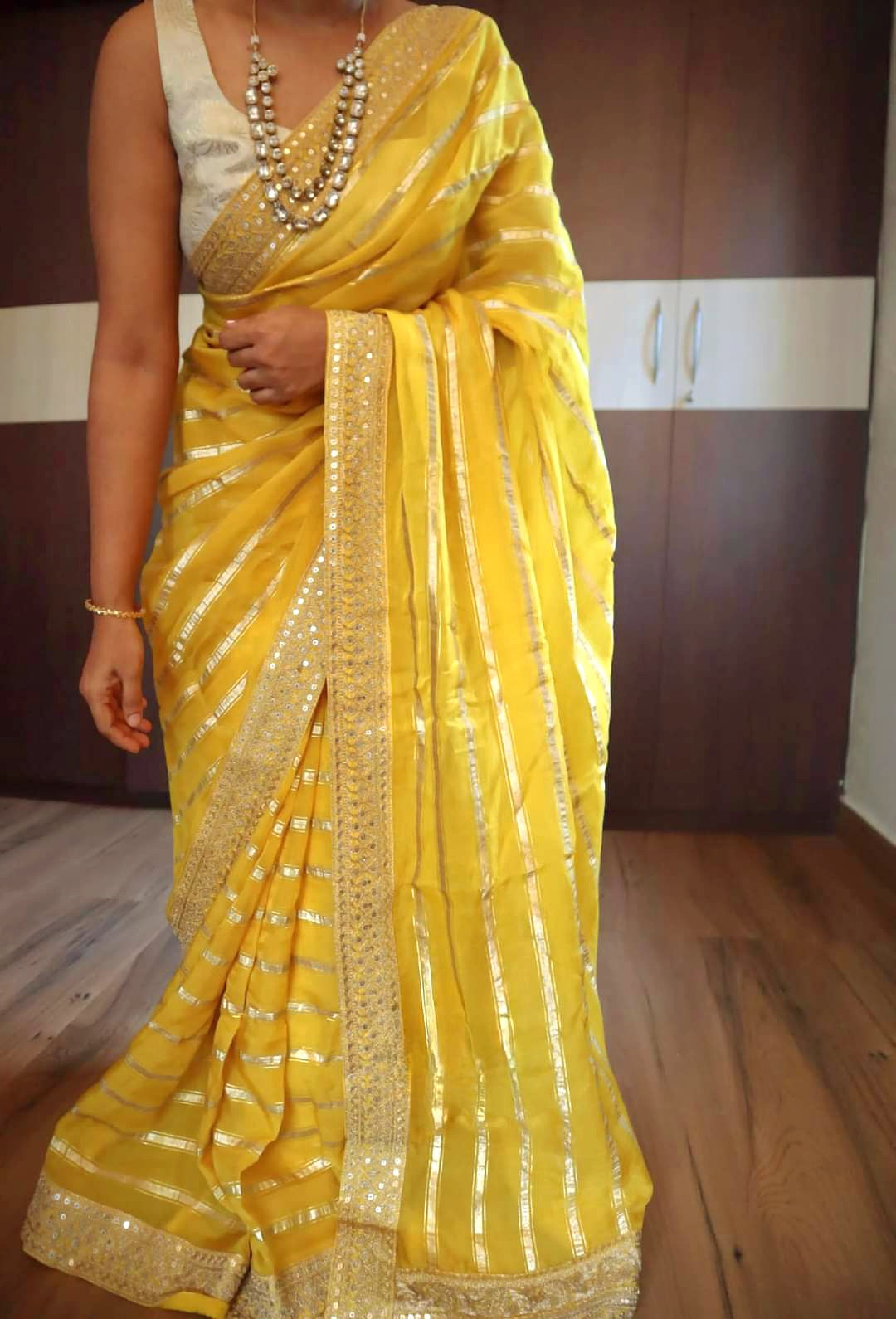 Yellow organza designer saree with stitched blouse