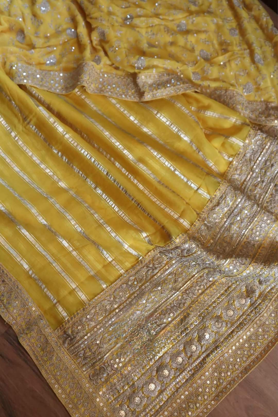 Yellow organza designer saree with stitched blouse