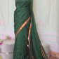 Bottle green/copper linen saree with stitched blouse