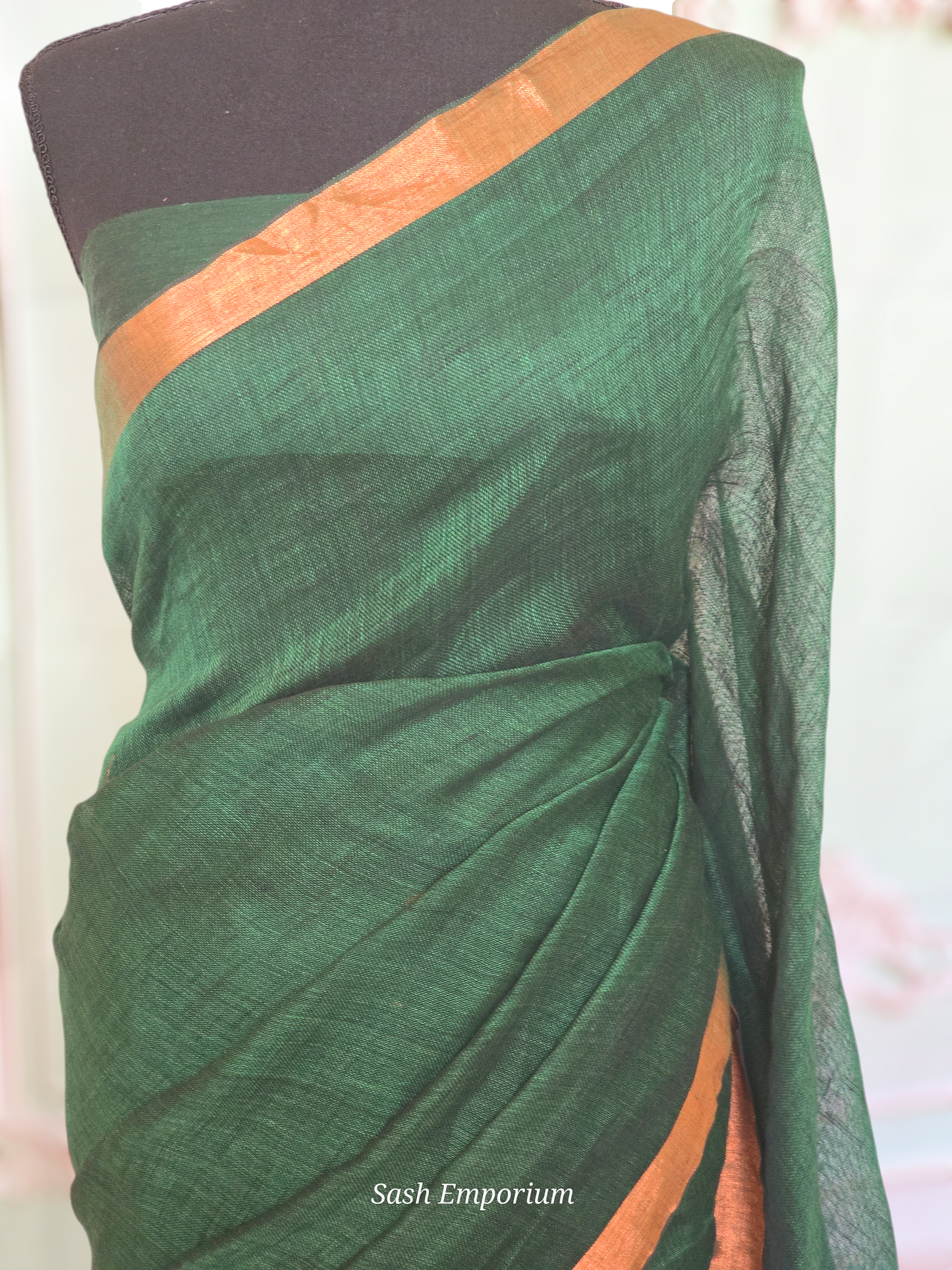 Bottle green/copper linen saree with stitched blouse