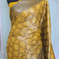 Semi brocade silk( yellow/black) with stitched blouse