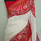 White/Red chiffon saree with white chikankari work on body and  patola border