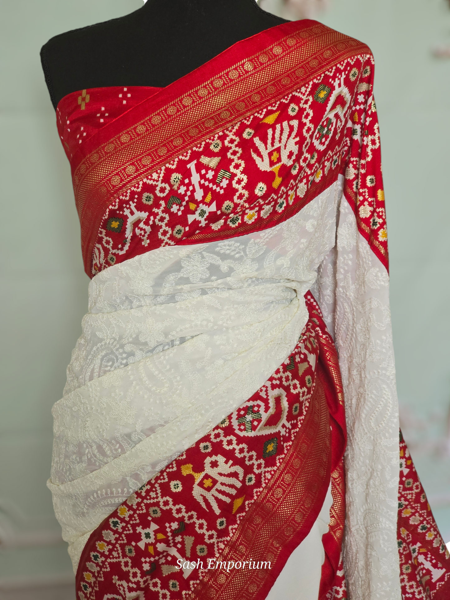 White/Red chiffon saree with white chikankari work on body and  patola border