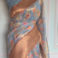 Sky blue floral print ( sky blue/brown) saree with stitched blouse