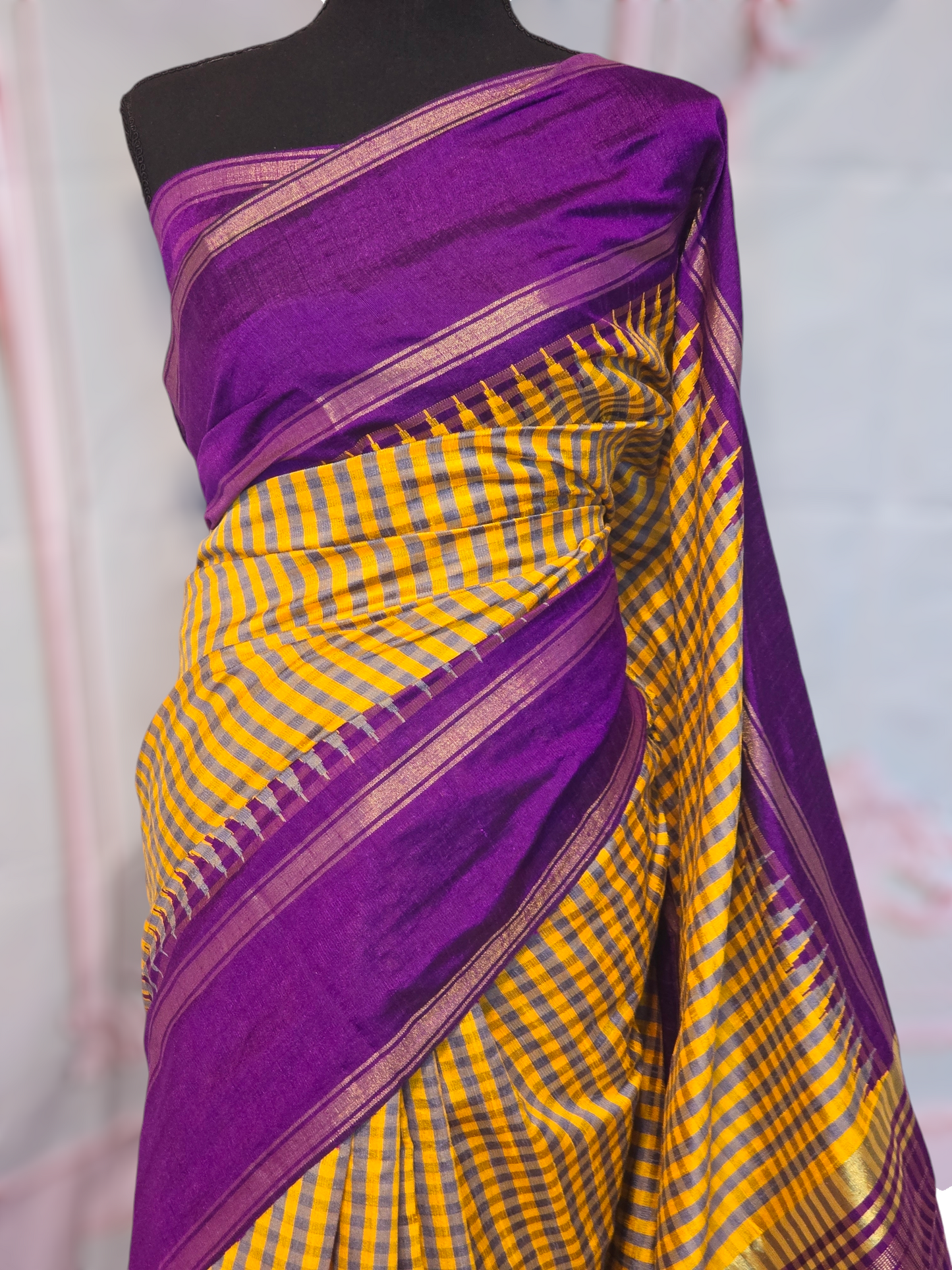 Yellow/purple check design raw silk saree with stitched blouse