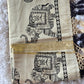 Tissue set saree with black elephant print on border and pallu