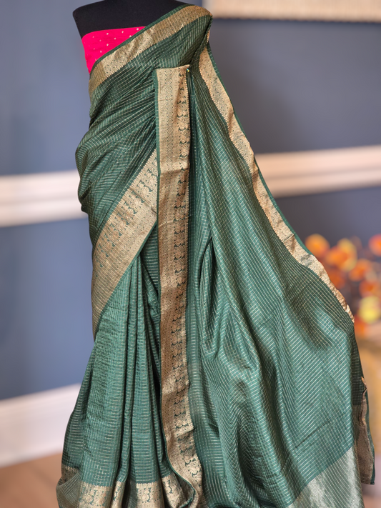 Crape silk saree with check design body= stitched contrast blouse