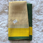 Semi tissue set saree with green and yellow comb