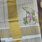 Gold tissue check set saree with lotus print