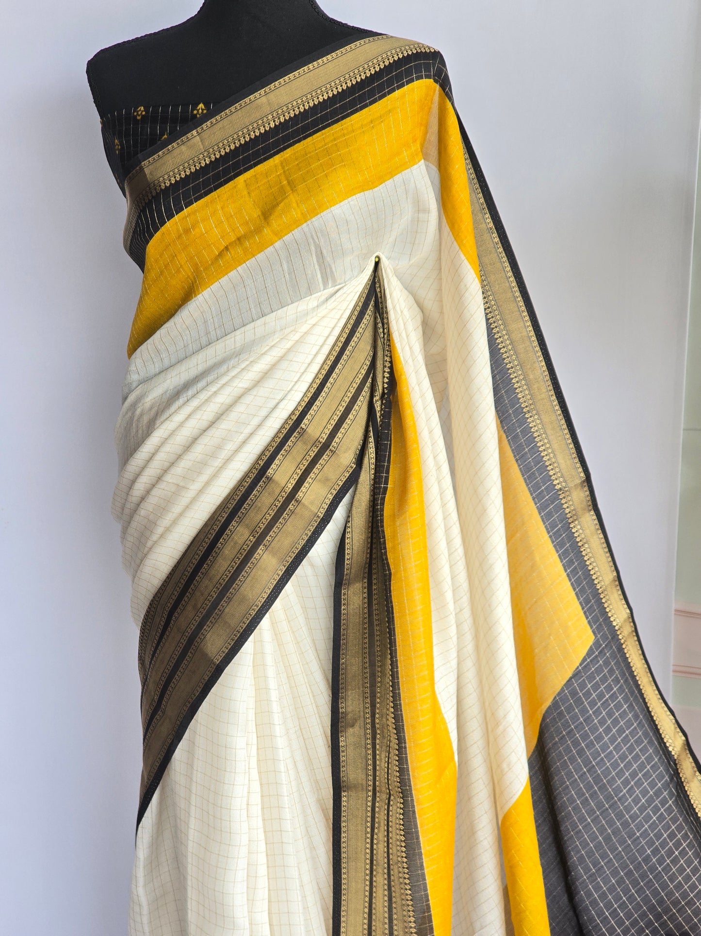Semi georgette saree with yellow black border-stitched blouse