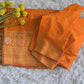 Semi munga (orange) silk saree with stitched blouse