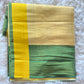 Semi tissue set saree with green and yellow comb