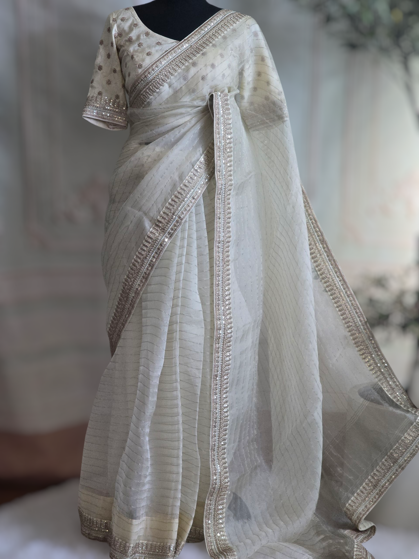 Off white organza saree with sabyasachi border- stitched blouse