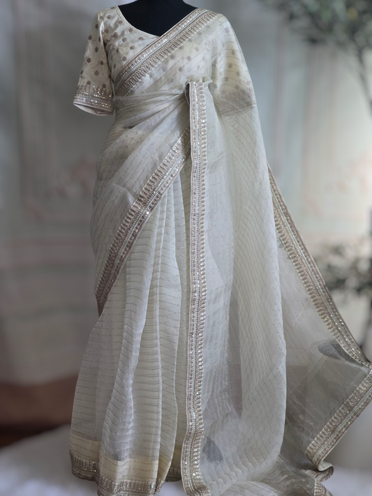 Off white organza saree with sabyasachi border- stitched blouse